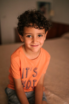 Portrait of curly haired child