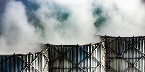 Steam exhaust from cooling towers inside a refinery