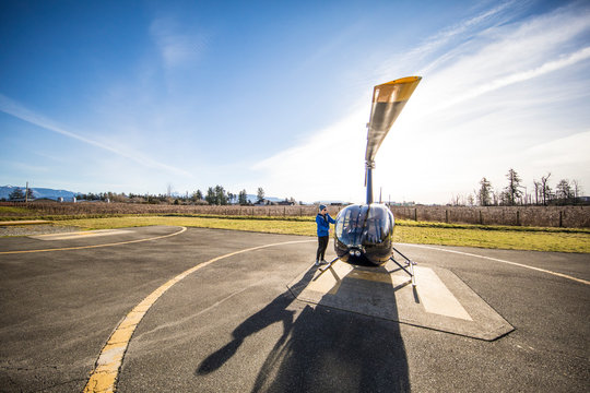 Pilot prepares his helicopter prior to a flight