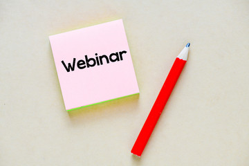 Webinar business text concept on sticky note.