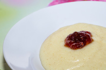 Semolina with jam on a green bamboo background