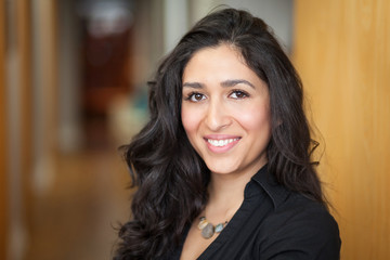 Mexican woman smiling at home. She is really happy.