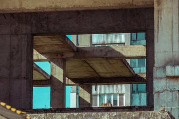 Modern construction site, concrete structure, building under construction, reinforced concrete structure. Construction site concept. Atmospheric background.
