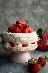 A Cake Made From Layers of Meringue, Whipped Cream, and Fresh strawberries.