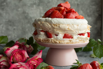 Cake with strawberries. Dark background.