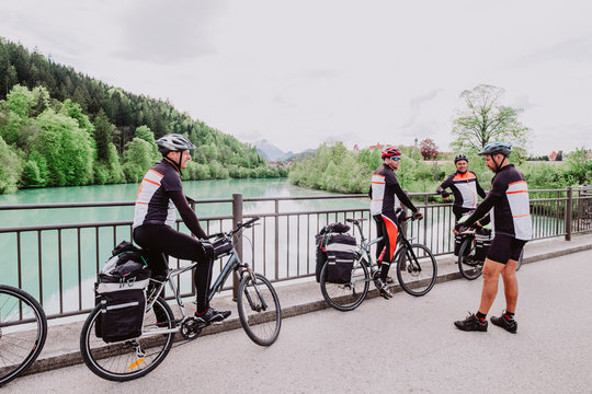 A group of cyclist resting in river in the romantische Strasse route
