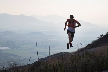 Train runner running with mountains in the background near el Arenal, hidalgo, Mexico