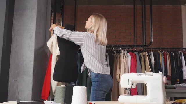 Young creative tailor making up a fashion stylish clothes, creativity concept