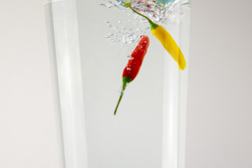 Fruit background falling into the water. Different fruits photographed in water.