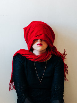 Red Scarf Over Young Woman's Head