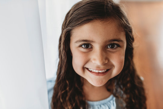 Portrait of little girl smiling at camera