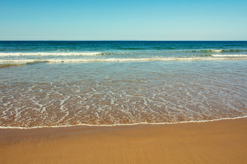 Fototapeta na wymiar wide angle shoot summer morning sand beach in the north coastline of Northern Ireland