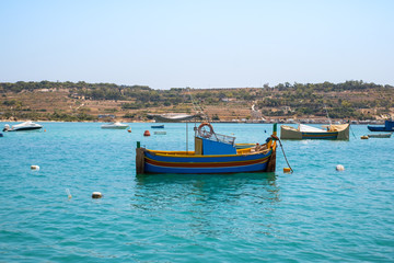 Naklejka na ściany i meble Traditional fishing boats Luzzu moored