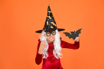 Magical spell. Small witch with white hair. Wizard or magician. Halloween party. Photo booth props. Small girl in black witch hat. Autumn holiday. Join celebration. Little child in witch costume