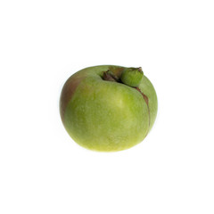 Trendy ugly food concept. Green apple isolated on white background. Fruit with a strange shape. The problem of food waste