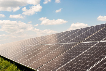 Sections of solar panels on the blue sky background