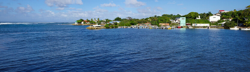 Fototapeta na wymiar The picturesque coastline of Le Moule town in Guadeloupe, Grande-Terre island, french West Indies