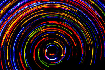 Rotating neon lights, spinning bright colorful laser lights background, modern nightlife and party concept, disco and dancing nightclubs pattern