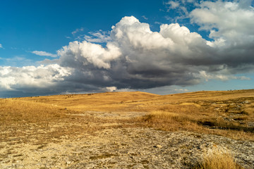 Fototapeta premium Field. Clouds. Autumn