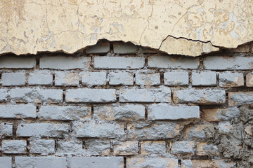 Texture of a brick wall with cracks