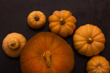 Pumpkins on black table. Halloween background