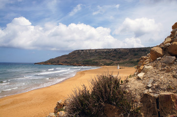 on red sandy beach in Ramla Bay, Gozo, Malta