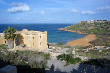 on red sandy beach in Ramla Bay, Gozo, Malta