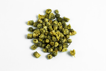 a group of dried chrysanthemum tea flowers on white background