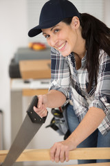 Obraz na płótnie Canvas happy young woman during home improvement
