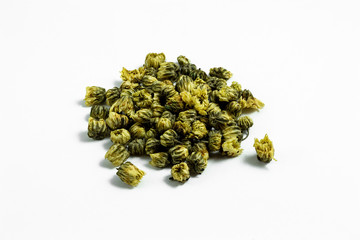 a group of dried chrysanthemum tea flowers on white background