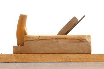 Old wooden hand planer or Carpenter Tool on wood plank isolated white background