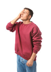 Portrait of young man after making mistake on white background