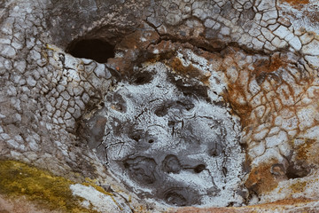 Closeup of solfatare mudpot s in the geothermal area Hverir, Iceland. The area around the boiling...