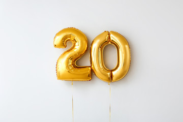 Figure 20 made of balloons on light background