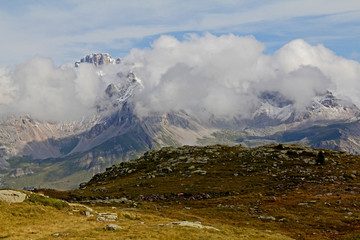 nuvole e neve settembrina su Punta Valfredda e monte La Banca; Val di Fassa, Trentino