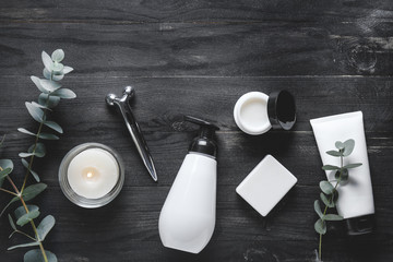 Accessories and cosmetics for personal hygiene on dark background