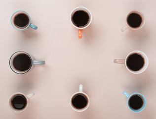 Coffee in the different cups on the gray background. Flatlay, cheerful day concept