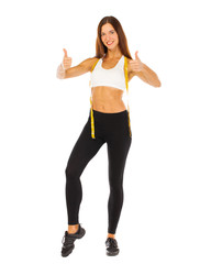 Obraz na płótnie Canvas Sexy fitness woman posing in studio - isolated on a white background