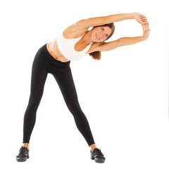 Sexy fitness woman posing in studio - isolated on a white background