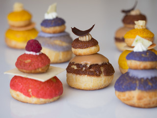 Colorful creamy profiterole, french dessert