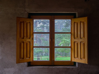 Open window in a mountain shelter on a winter morning.