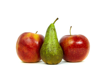 Red apples and pear isolated on white. The concept of eating fruit, eating meals with vitamins. Taking care of yourself, diet. Healthy food, apples, pears.