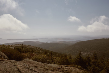 View of Maine coastline in the distance from Cadillac Mountain on Mount Desert Island in Acadia National Park