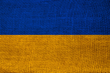 photo of the beautiful colored national flag of the modern state of Ukraine on textured fabric,...