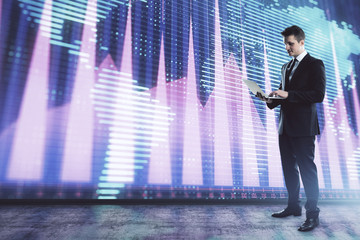 Fototapeta premium Businessman and forex graph and world map hologram. Double exposure. Concept of financial education and analysis