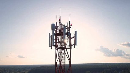 Flight up on drone along telecommunications tower - Powered by Adobe