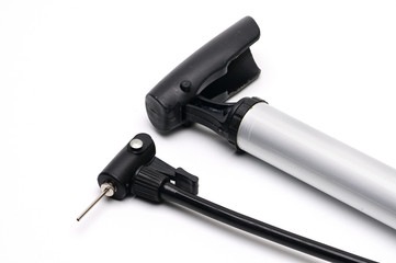 Pump and needle for pumping air on a white background