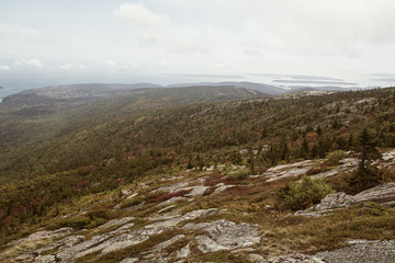 View of Maine coastline in the distance from Cadillac Mountain on Mount Desert Island in Acadia National Park