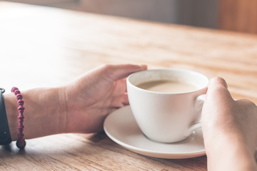 woman hold a cup a coffee