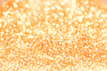 Abstract christmas golden lights on background. Defocused.